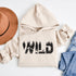 Step into the wild with our unique camping hoodie, featuring a captivating camping scene intricately etched inside the words "Into The Wild". Crafted for outdoor enthusiasts, this hoodie is not just a piece of clothing but a symbol of adventure and exploration.